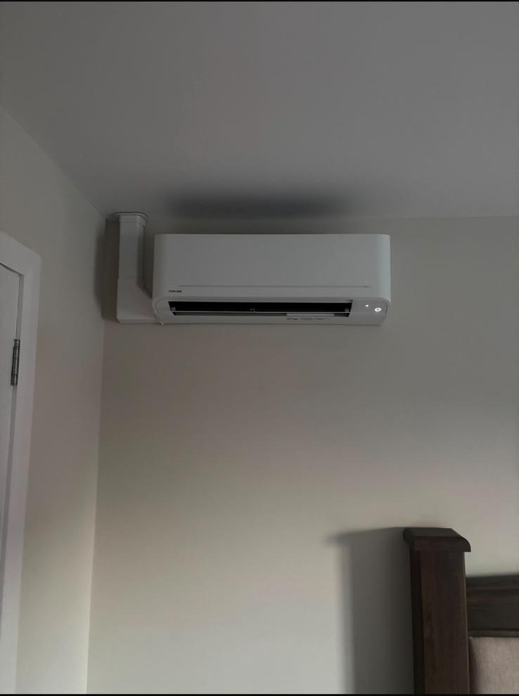 Toshiba air conditioning unit neatly installed in a bedroom