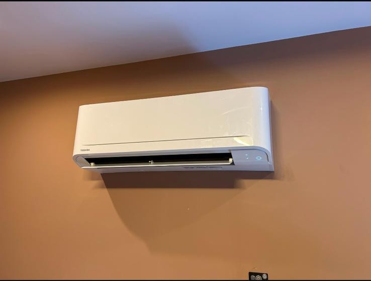 Toshiba wall-mounted air conditioning unit in a living room